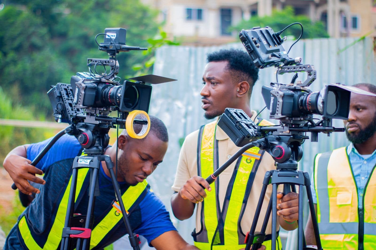 Two camera operators on a road shoot
