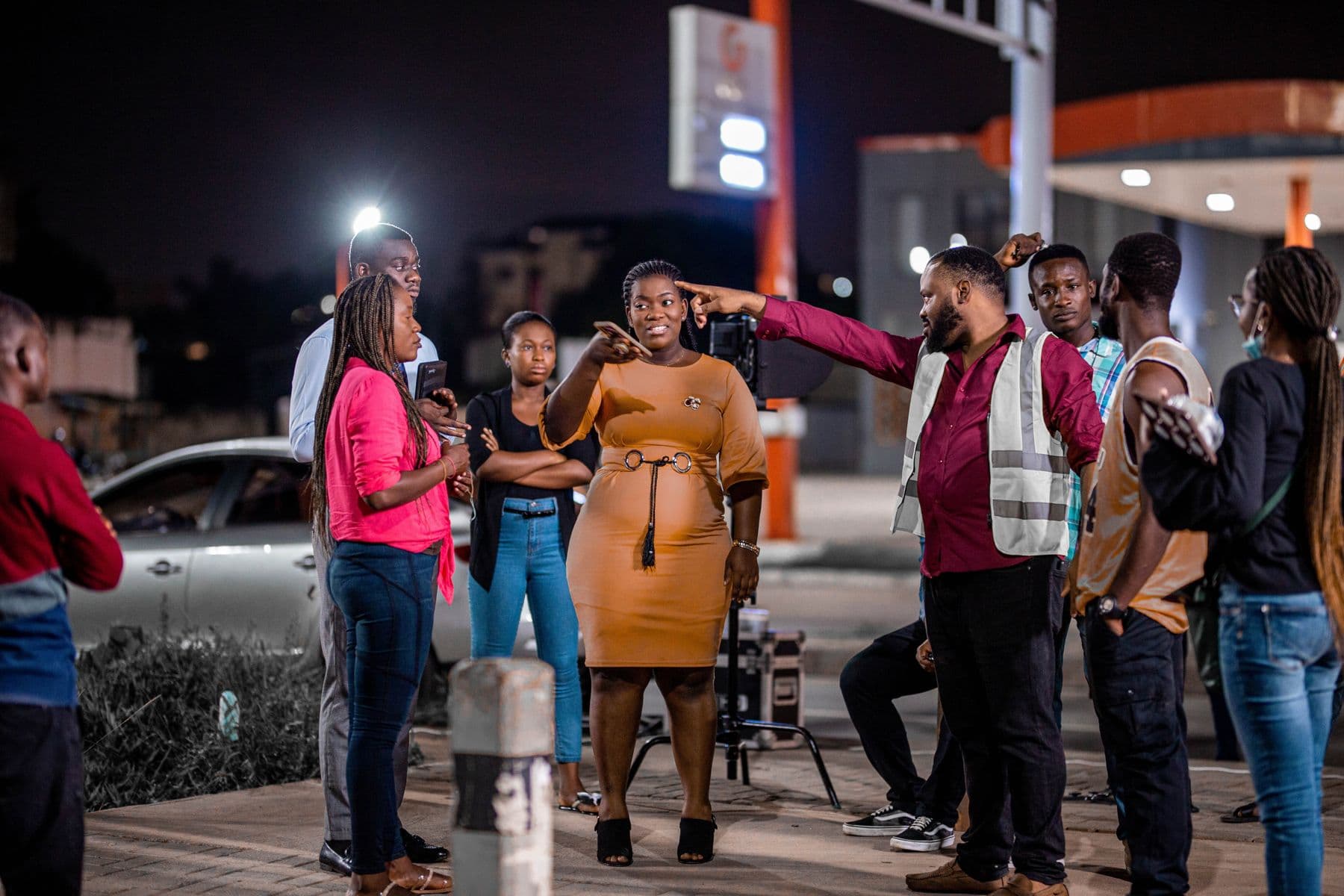 A crew at work on a street at night